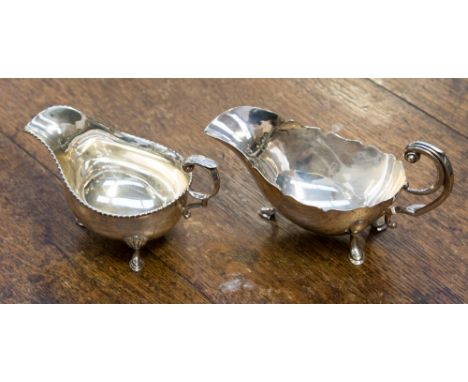 An Edwardian silver sauce boat, double scroll handle, hoof feet, Viners, Sheffield 1936, 7.93ozt; a George VI silver sauce bo