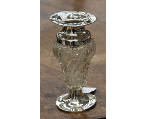 A moulded and cut glass vase on silver pedestal, with flared silver rim, hallmarks being heavily rubbed and indistinct