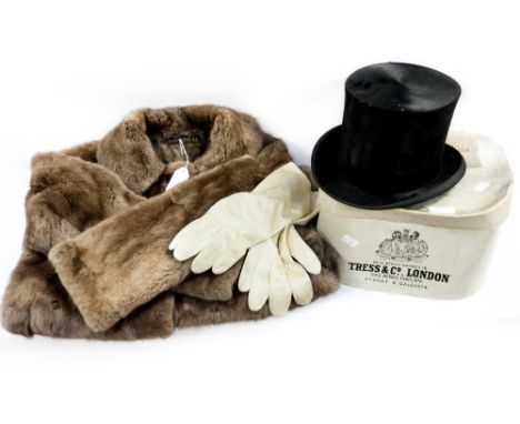 A silk top hat 1920/30s, in original box, an early 1960s Musquash coat in a light brown colour with a good checked lining (2)