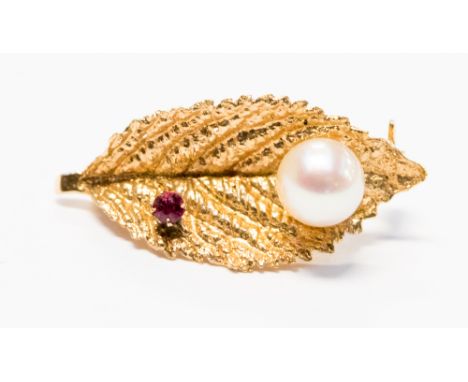 A gold, pearl and ruby leaf brooch, approximately 24mm, gross weight approximately 1.6 grams