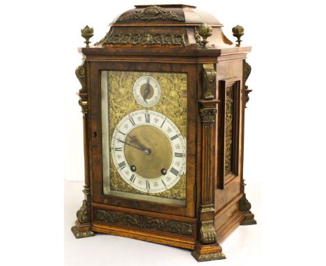 A large bracket clock, polished figured walnut, caddy top with metal fretwork, reverse finial and feet, housing a Lenzkirch e
