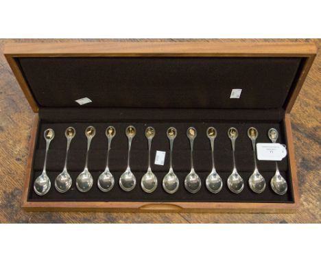 Cased silver R.S.P.B. silver spoon collection. London 1976. Approx 10.53 ozt including Gilded finial's.