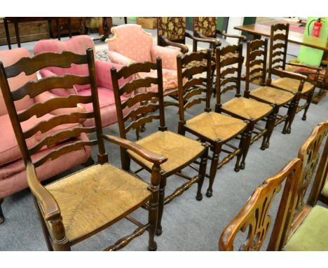 Set of six 19th century style oak ladder back rush seated dining chairs, including two carvers 