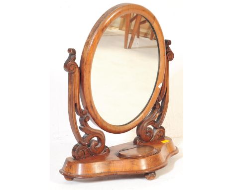 A 19th century Victorian mahogany toilet swing mirror. The mirror having a dome top, shaped mirror supports raised on shaped 