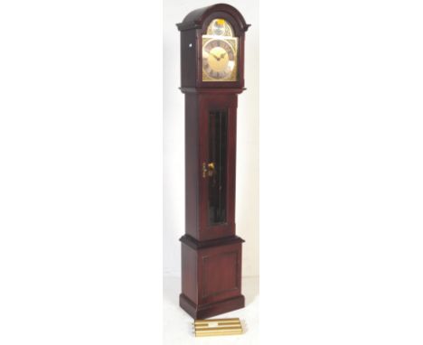 A 20th century mahogany Regency revival longcase clock. The clock being set within mahogany case with domed top, exposed pend