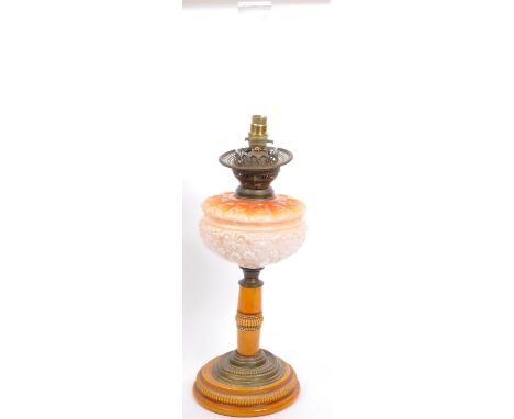 An early 20th century Wright &amp; Butler oil lamp having ceramic base with beaded decoration and opaline glass reservoir in 