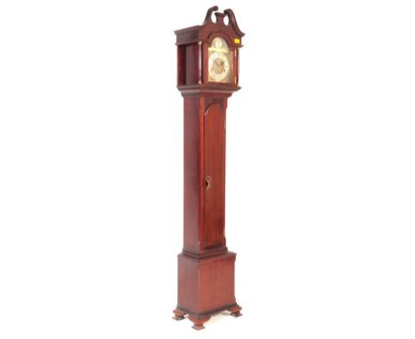 A 20th century mahogany cased longcase Tempus Fugit clock. The clock having carved swan neck top to case over stylobate base.