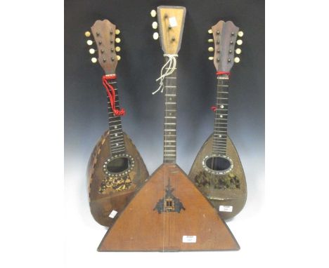 Two Mandolins, one with Achille Lanfranco e Figlio label, the other Stridente, both A/F, together with a Balalaika (3)