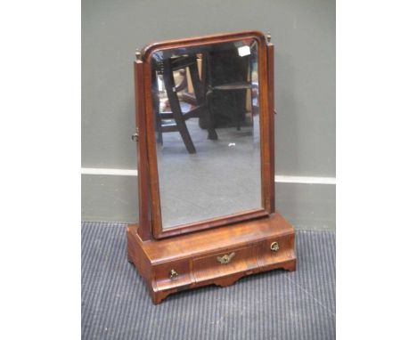 An 18th century walnut dressing table mirror, 55cms high