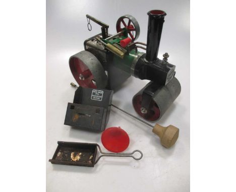 A boxed Mamod live steam model roller, together with two shooting sticks