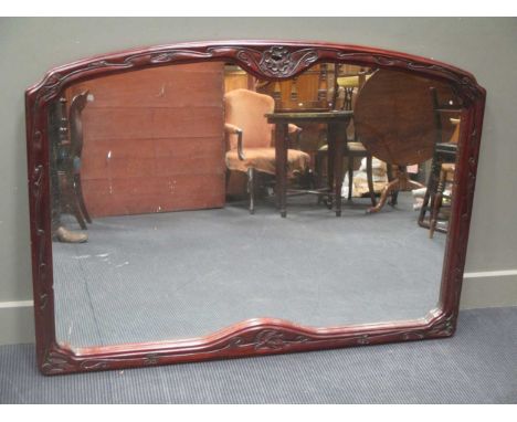 A mahogany moulded frame wall mirror with trailing leaf design 100 x 140cm