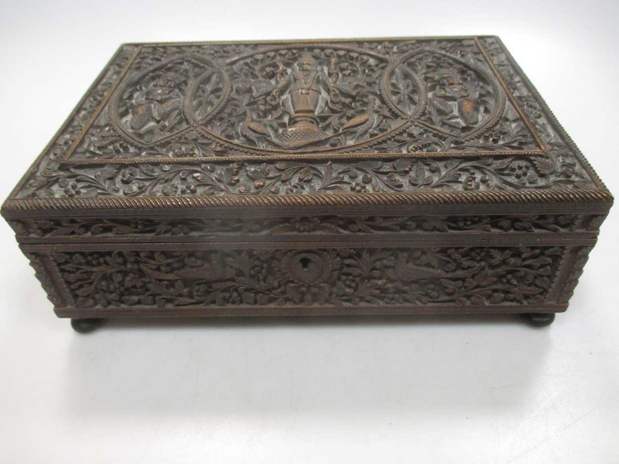 An Indian/Asian carved wood box, probably c.1900, with three figures to