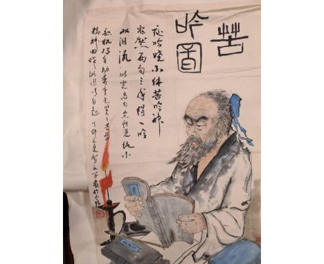 A Chinese painting, 20th century, of a scholar at his desk with books by candlelight, inscription and one red seal, ink and c