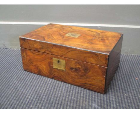 A Victorian walnut and ebony strung writing slope, with brass plaque and monogram BC; and a Regency rectangular toilet mirror