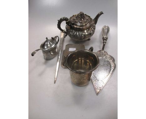 A silver bachelor's teapot, a silver mustard and spoon, a silver child's cup and a silver meat skewer 26.3ozt gross together 
