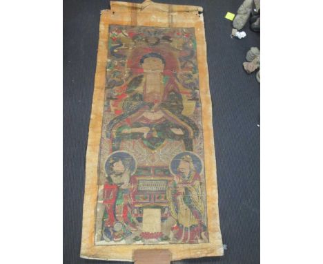 A Chinese Buddhist hanging scroll, depicting a Buddha seated above two Bodhisattvas, Qing Dynasty, 19th century