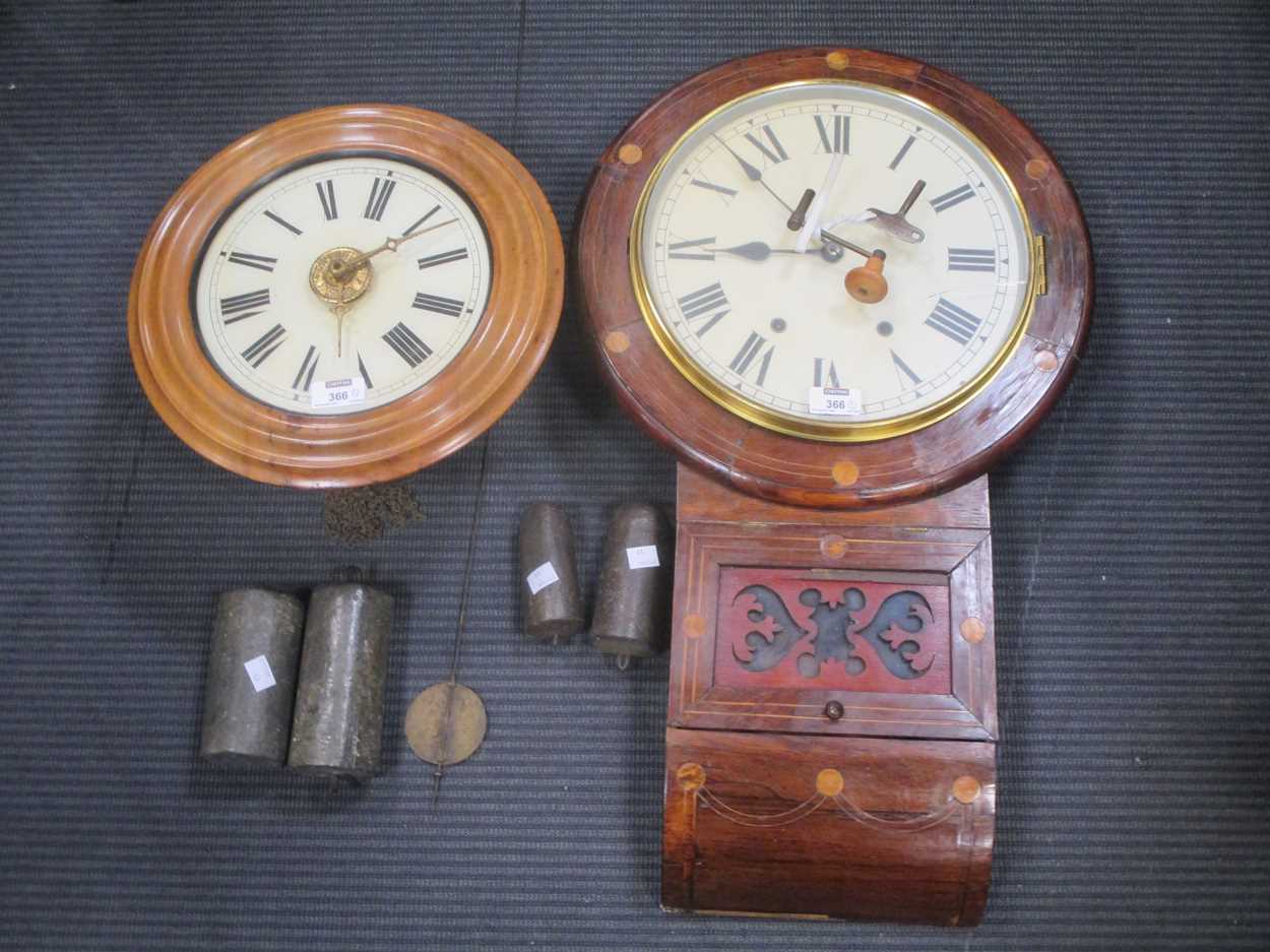 A postman's alarm wall clock, a Vienna type drop dial wall clock and a