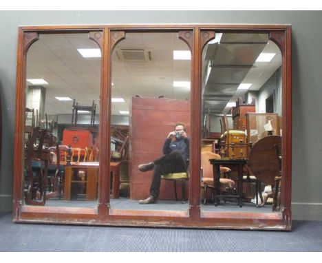 A large mahogany triptych style mirror, designed by Sir George Gilbert Scott for The Midland Grand Hotel, St. Pancras Station
