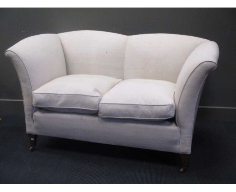 A two seat ivory upholstered fan-back sofa, on mahogany legs with castors 93 x 170 x 97cm