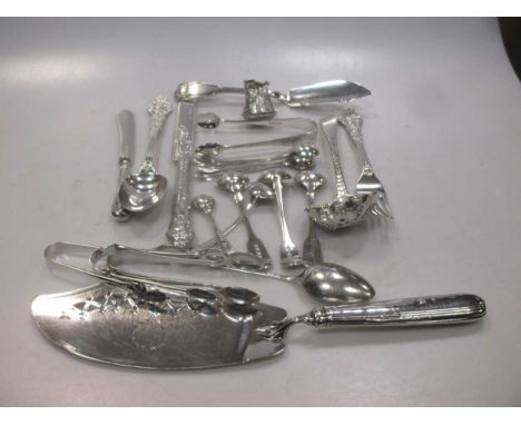 Various cutlery and flatware, including silver handled table knives, a silver fish slice, tongs and condiment spoons, a berry