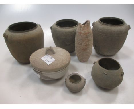 Seven Chinese ceramic small vessels, Han Dynasty, 10th century, including five graduated "cloth" moulded jars (tallest 9cm), 