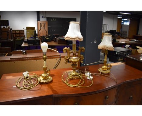 A three lamp set of plaster gilt table lamps