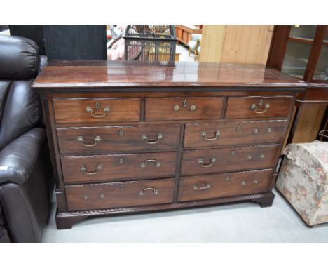 An early 19th century mahogany Lancashire style mule chest having lift lid with front dummy and four short drawers on bracket