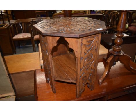 An octagonal carved occasional table, in the Celtic style, width approx. 45cm, height 47cm, little bit of wear and tear but g