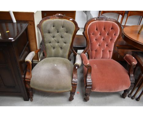 A matched pair of Victorian stained frame 'his and hers' low seat armchairs having button back dralon upholstery