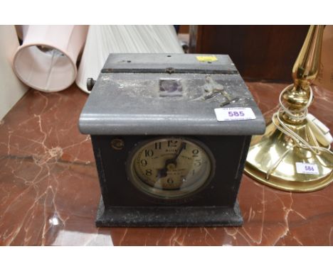 A vintage Blick time recorder clock