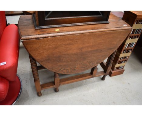 A mid 20th Century oak twist gate leg table