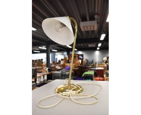 A brass desk or table lamp