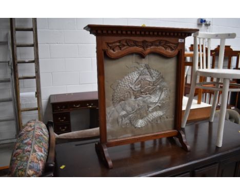 A mahogany framed firescreen having Oriental style silkwork inset