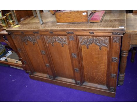 A church vestibule tabernacle base having extensive gothic decoration in traditional oak with shelf to back
approx 75cm deep 