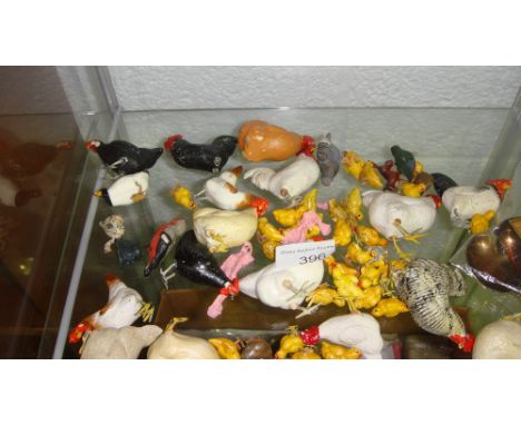 Shelf of vintage chicken ornaments some pottery some metal