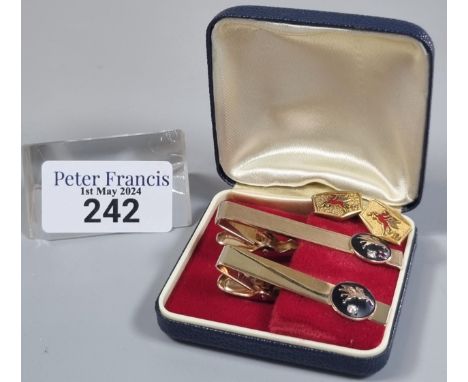 Two similar tie pins, one marked 10K, both with gold pendants of Pegasus horse, ruby and diamonds. 14.9g approx. Together wit