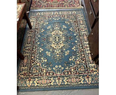 'Mister Magic' modern geometric design rug together with a Middle Eastern design red ground foliate rug and another modern bl
