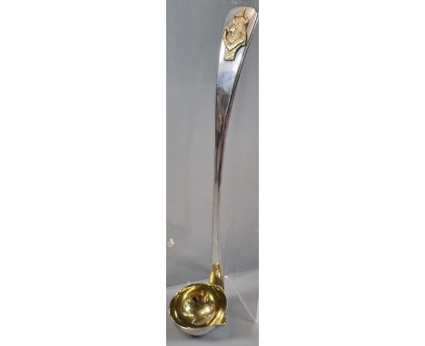 20th century Toddy ladle with gilded Egyptian portrait  pressed and gilded bowl.  London hallmarks.  19cm long approx.  1.89 