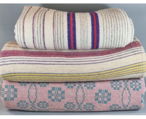 Three vintage woollen blankets or carthen to include: two striped narrow loom and a pink and cream Welsh tapestry blanket. (3