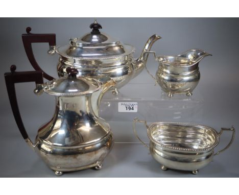 Queen Elizabeth II silver tea service comprising: teapot, two handled sucrier and helmet shaped cream jug by Adie Brothers Lt