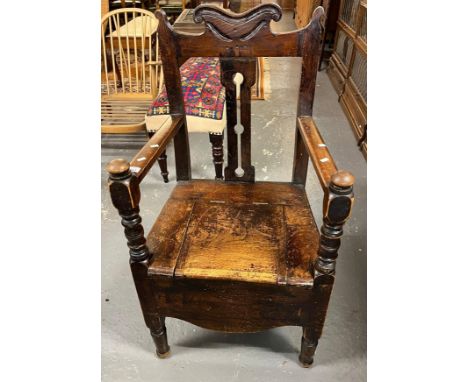 19th century stained elm and beech commode armchair.   (B.P. 21% + VAT) 