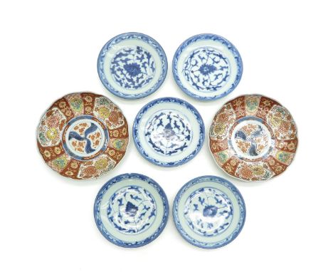 2 larger plates with orange and gold decor, 5 small blue and white floral decor plates, largest is 19 cm. in diameter, some w