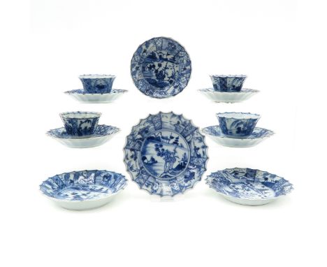 18th Century, including 8 saucers and 4 cups, blue and white decor, saucers are 11 cm. in diameter.