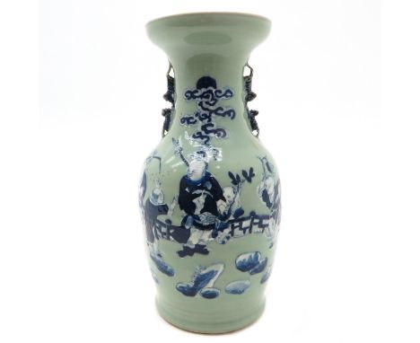 Blue decor of Chinese men playing in garden, 44 cm. tall, chip on handle.