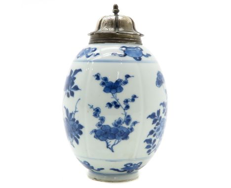Kangxi, blue and white floral decor with silver top, marked on bottom with leaf, 16 cm. tall.
