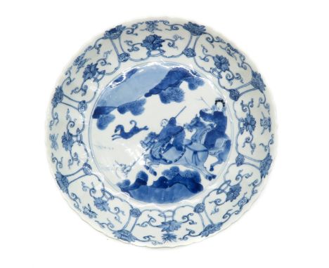 Kangxi, blue and white decor of hunters on horseback, marked with double ring and 6 characters, 19 cm. in diameter, restored 