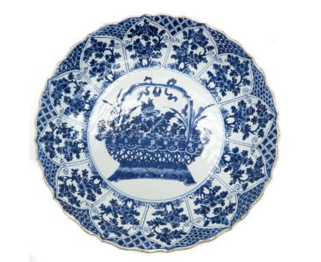 Kangxi, blue and white floral border with basket of flowers in center of plate, marked with double ring and conch shell, 34 c