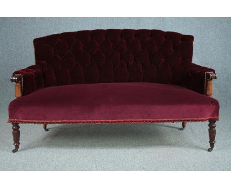 Sofa, early 19th century mahogany framed in deep buttoned upholstery. H.90 W.155 D.73cm. 