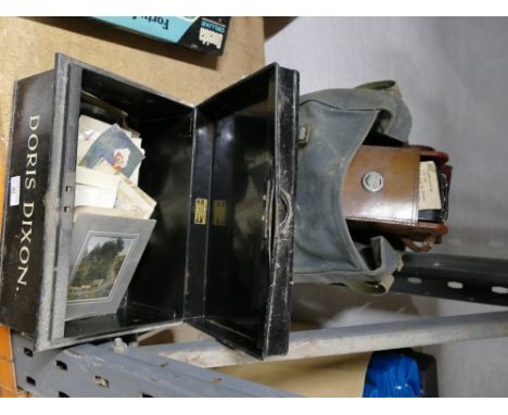Vintage cash tin containing postcards, wooden box containing vintage cutlery and canvas bag containing folding camera 