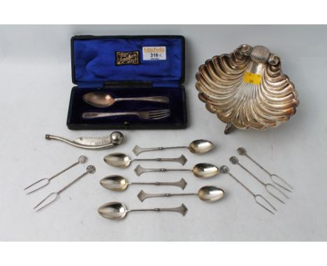 Plated metal seashell, six plated teaspoons, five Oriental white metal prongs, Bosun's whistle and silver hallmarked boxed sp